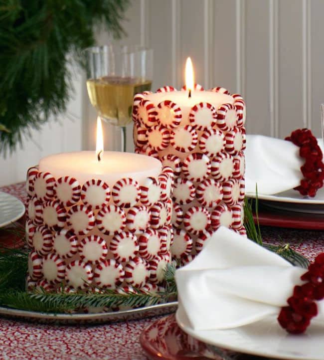 Christmas candies glued to white pillar candles