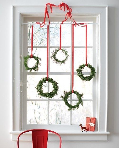 Lovely-Green-Wreaths-Hung-on-Window’s-Top