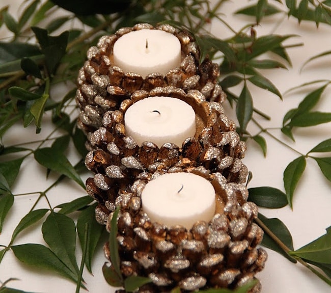Shimmery pinecone candle holders with white tea lights
